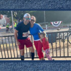 Michelle Striowski, VP of Corporate Strategy, stands with husband and daughter