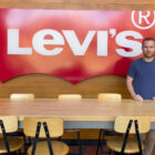 LS&Co. employee Preston Zorner standing in front of a Levi's® logo sign.