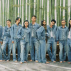 Nine individuals stand against a bamboo background and wear head-to-toe denim looks from the new Levi's® x BEAMS collection.