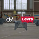 a white o9 logo x a red Levi's® logo are imposed over a photo of various Levi's® denim tied together as a rope and held up in an industrial warehouse.