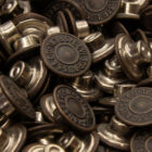 A pile of LS&Co. branded metal buttons