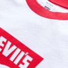 Close up of a white ringer tee with a red collar and a red Levi's® batwing logo graphic reading "Levii's"