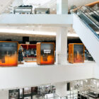 A Levi's® pop-up shop in a Holt Renfrew department store, viewed from the escalator well