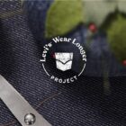 a white logo reading "Levi's® wear longer project" overlaid on top of an image of a piece of denim, sewing scissors and a denim pin cushion. White text reads "repair, refresh and reimagine your clothes"