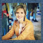 a headshot of LS&Co. SVP and chief communications officer Kelly McGinnis overlaid on top of a denim background