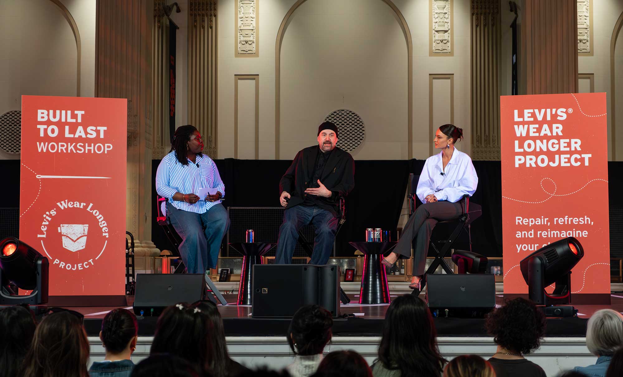 Kristin Juszczyk, designer and co-founder of Off Season (right), and Paul Dillinger, head of Global Design Innovation at Levi Strauss & Co. (middle), sit on stage next to a panel moderator (left) for a Levi's® Wear Longer Project workshop panel at Levi's® Home Turf.
